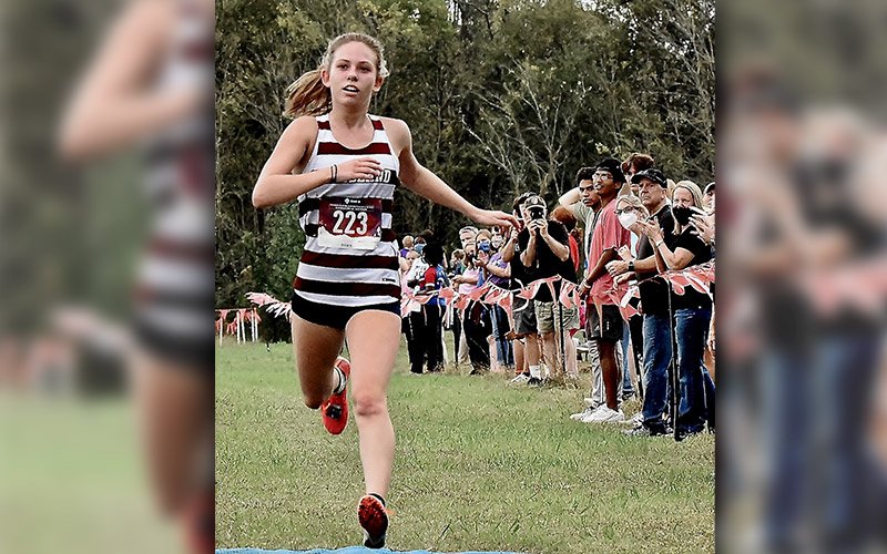 Read more about the article Evans wins region XC meet; Wildcats, Canes post top-3 finishes